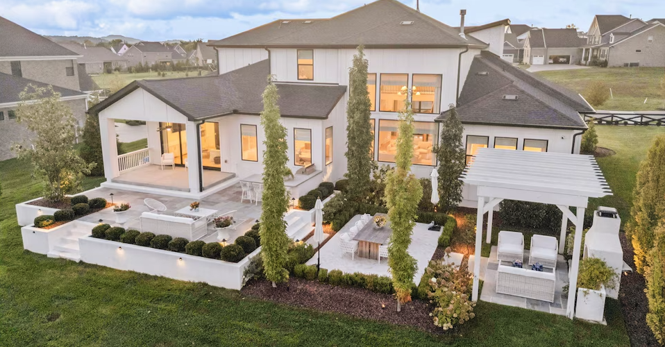 Luxury Franklin, Tennessee estate with landscaped patio at dusk